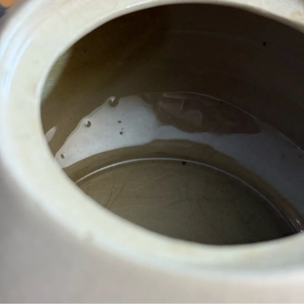 Antique brown and white ceramic teapot‎